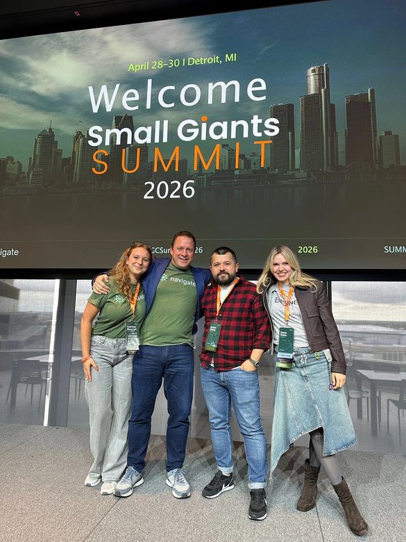 Four of us on stage at the Small Giants Summit 2026