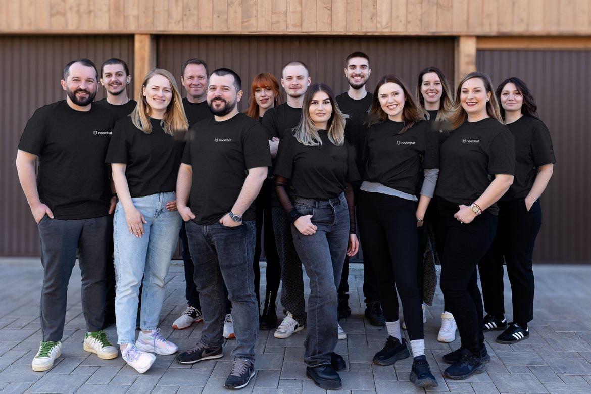 The team in noombat t-shirts outside the office